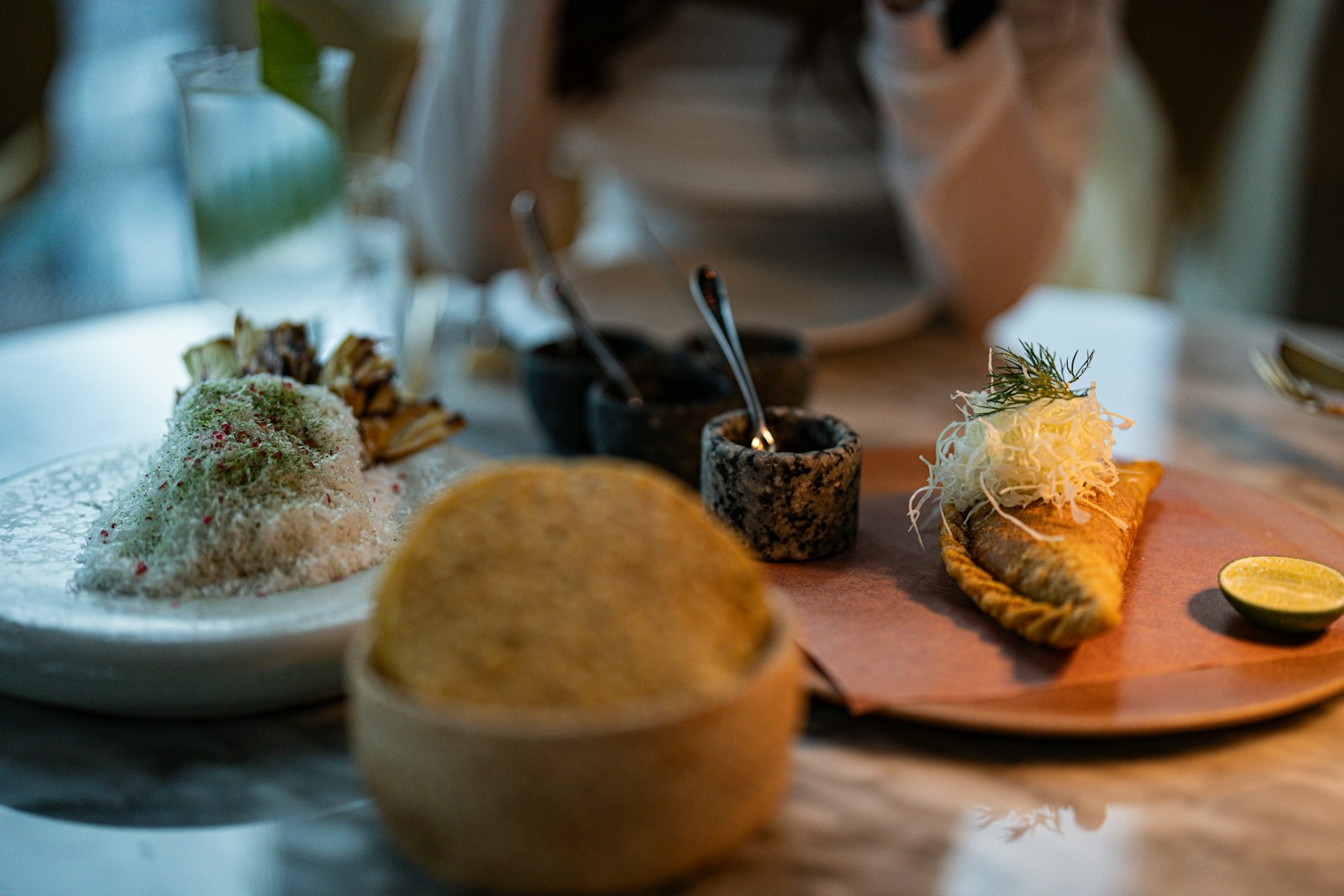 Two carefully plated dishes on a restaurant table